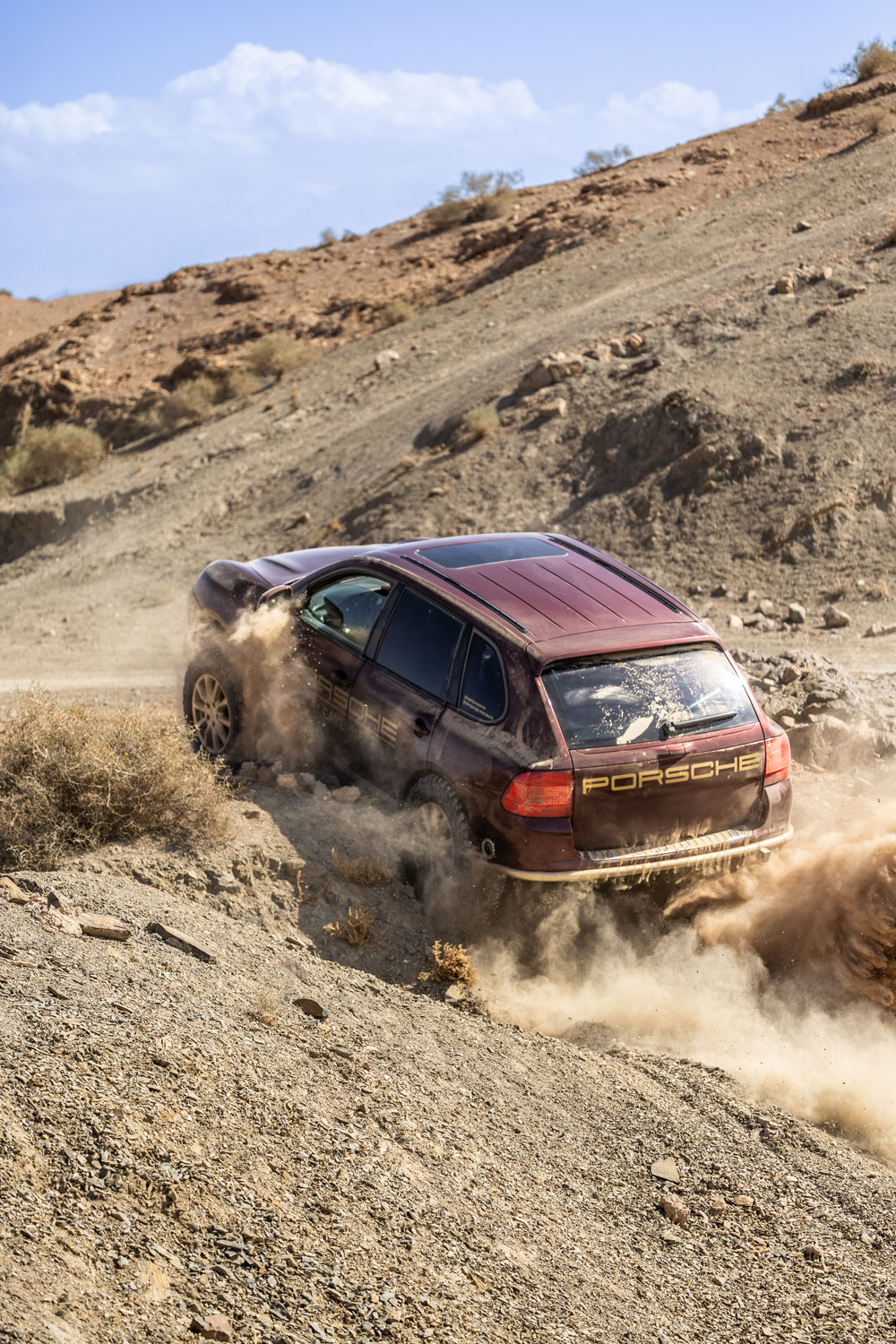Porsche Cayenne going up a hill Agafay Cayenne Experience - Off-Road Porsche experience