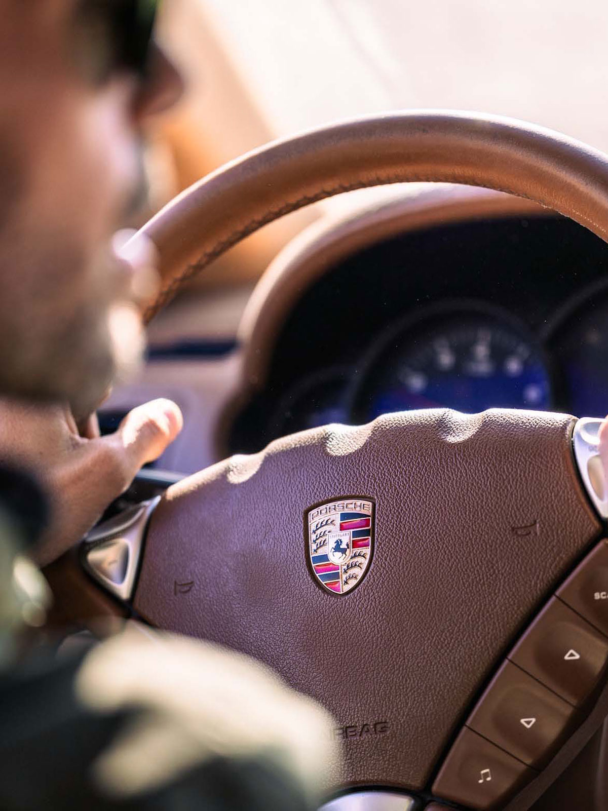 Driver on the wheel from behind for Agafay Cayenne Experience - Off-Road Porsche experience